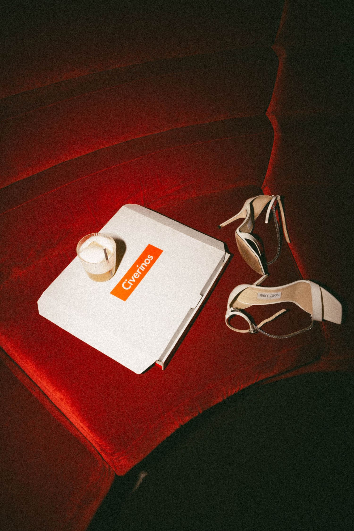 A series of photographs showing a white tea bag tag against a red velvet background in different compositions and angles.