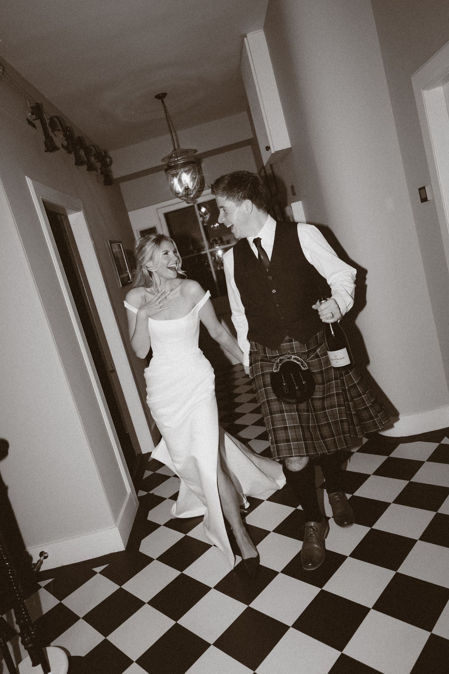 A black and white photo sequence showing people dancing on a checkered floor in what appears to be a hallway.