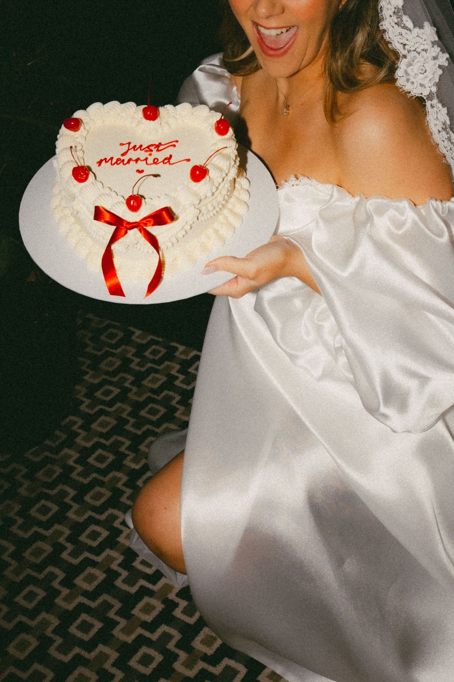 A series of photos showing a white wedding dress and decorative wedding cake with red accents and ribbons.