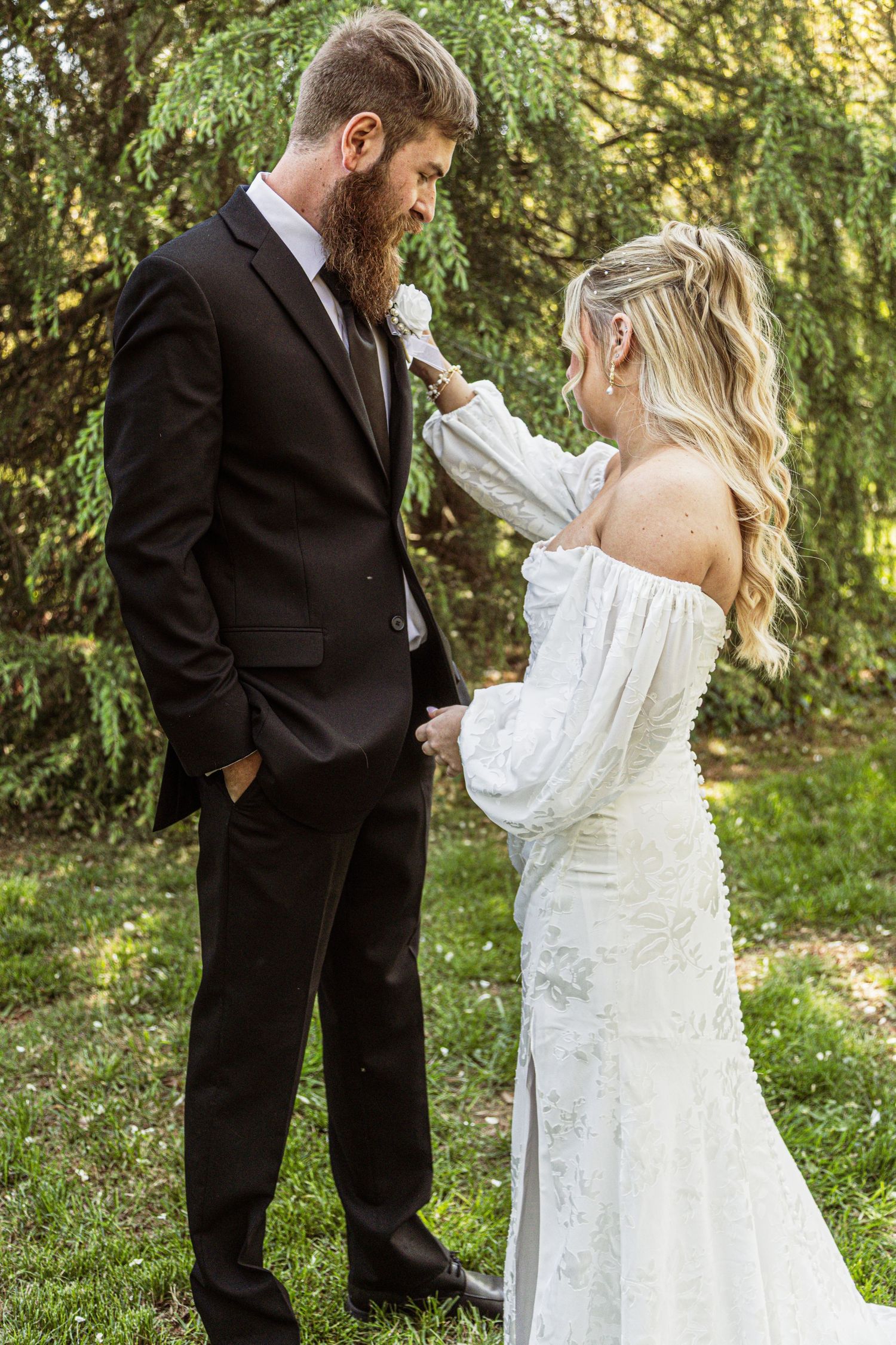 Wedding couple sharing intimate moments during outdoor photo session.