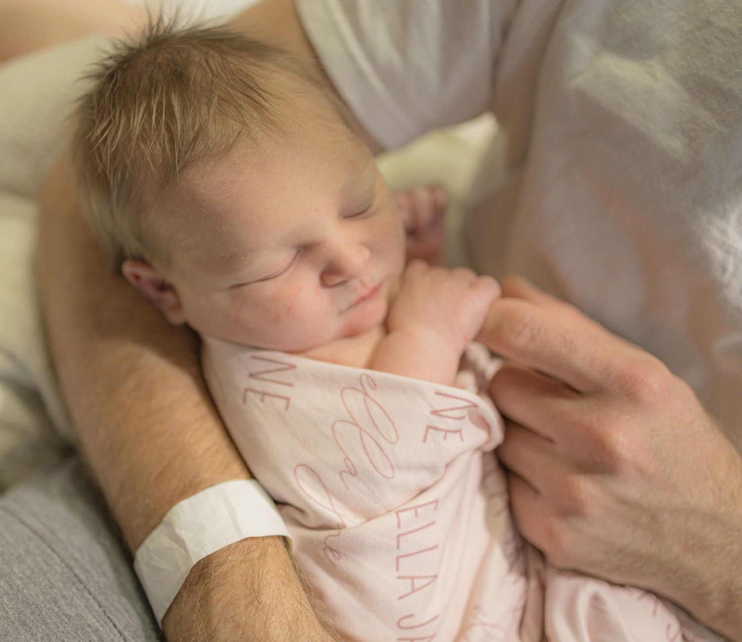 A series of tender moments captured in sequence showing a sleeping newborn being gently caressed by a parent's hand.