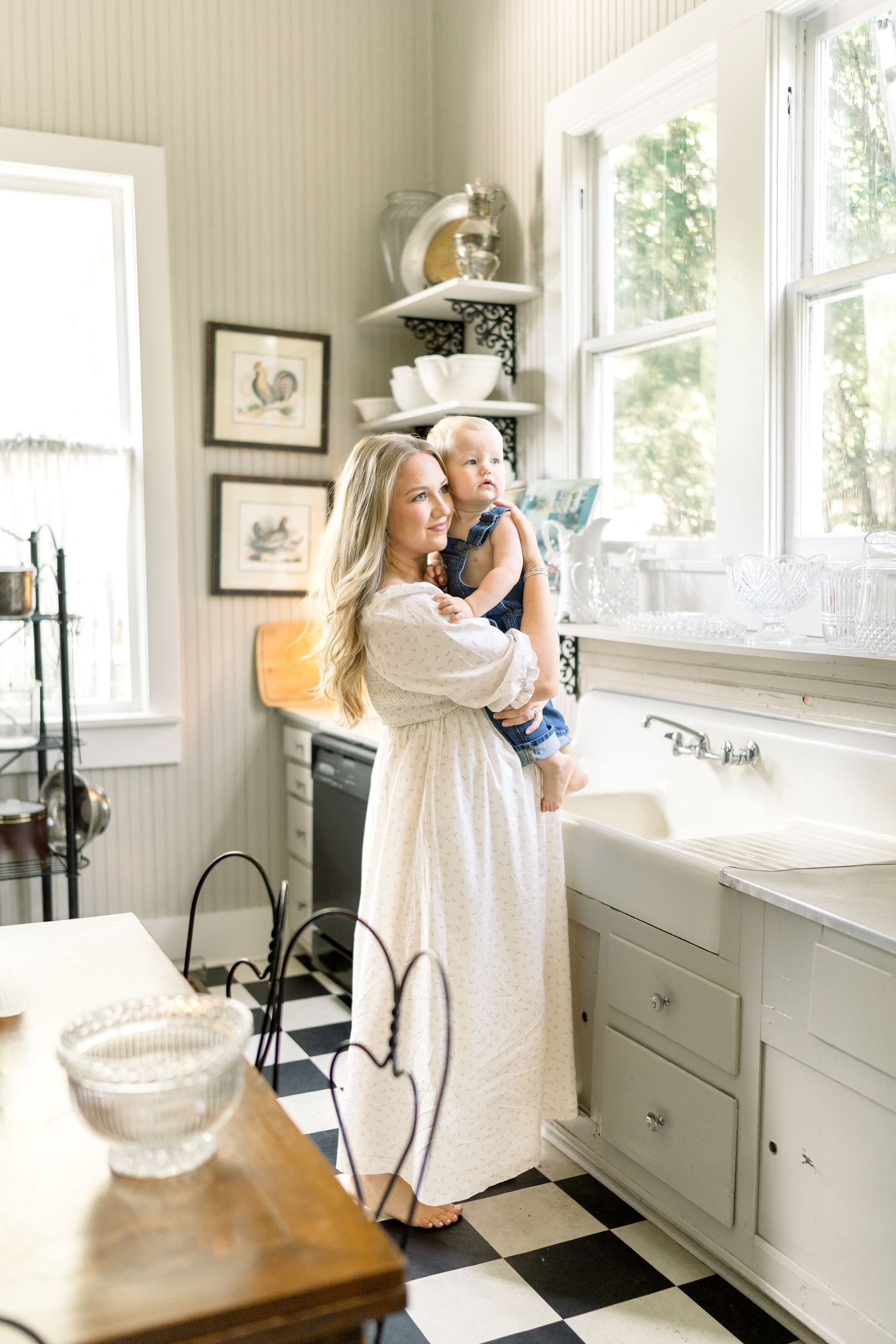 a mother holding her baby boy in a charming farmhouse located in hattiesburg, mississippi. motherhood photography. motherhood photographer