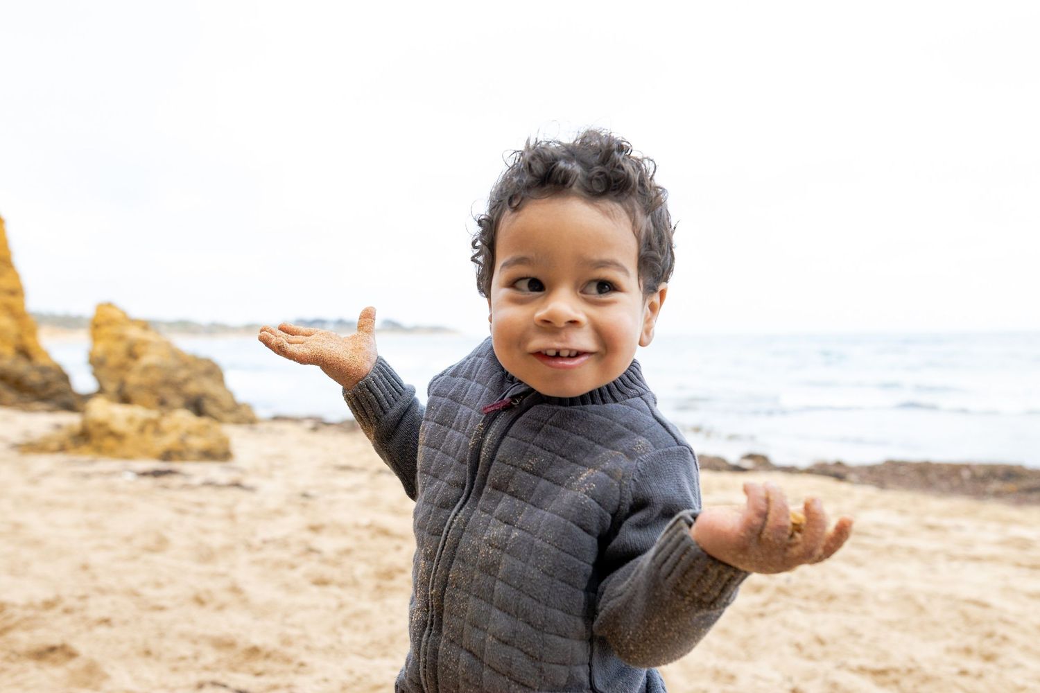 Toddler doing a cheeky look Outdoor family session Torquay