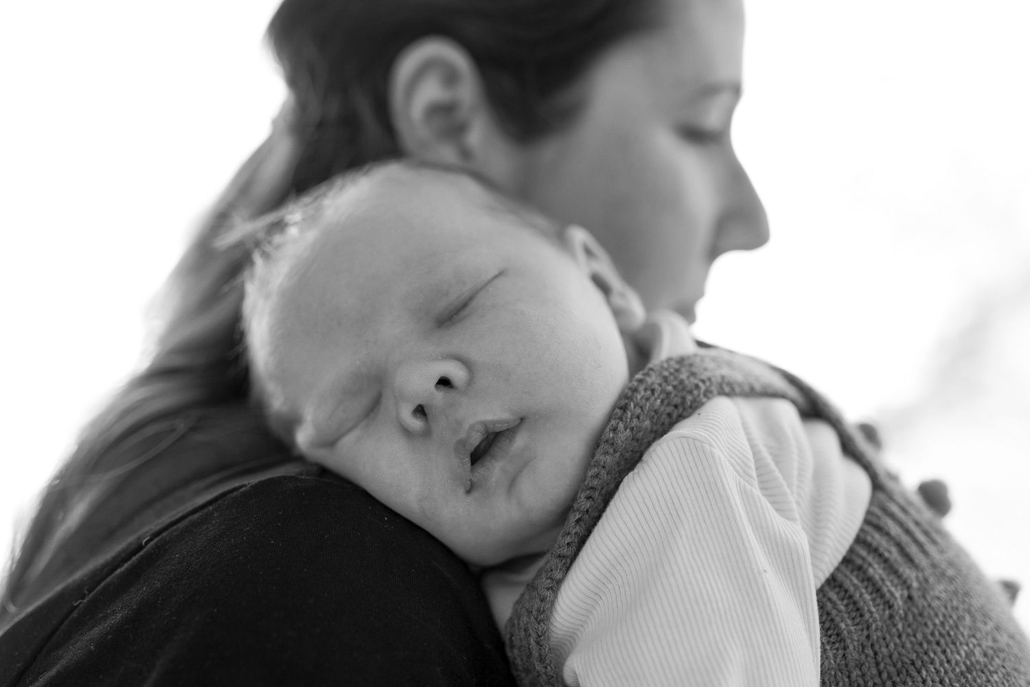 Newborn baby boy sleeping on his mother's shoulder cheek squished At home newborn session Moonee Ponds Melb Vic