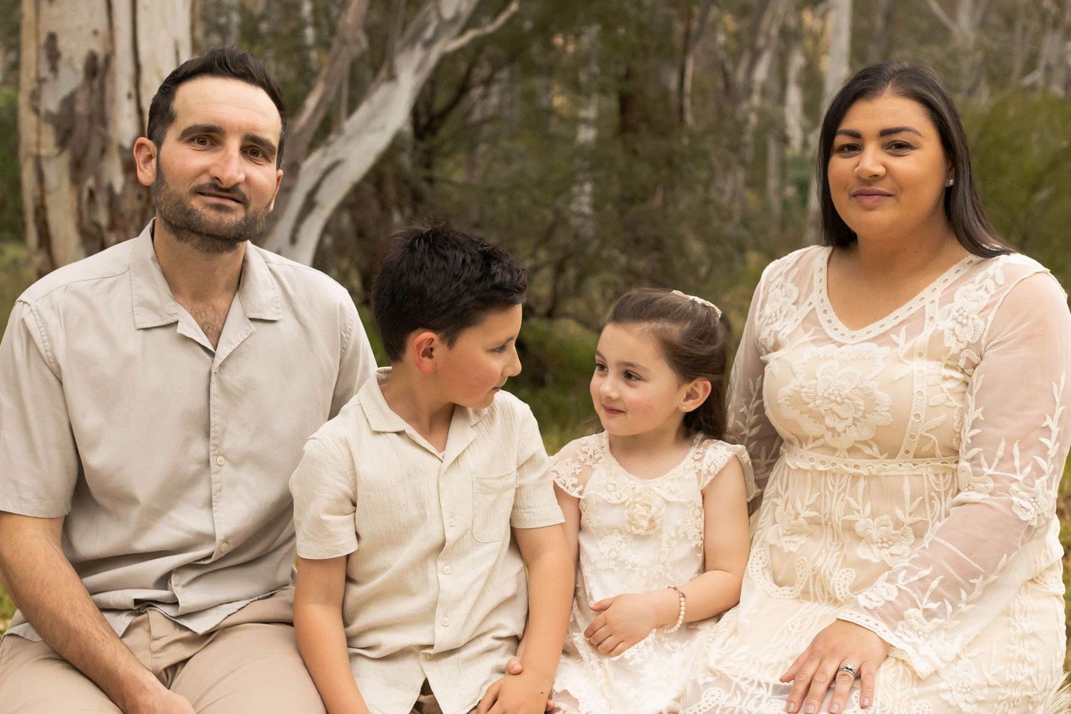 Family sitting surrounded by bushland Avondale Height family outdoor photoshoot