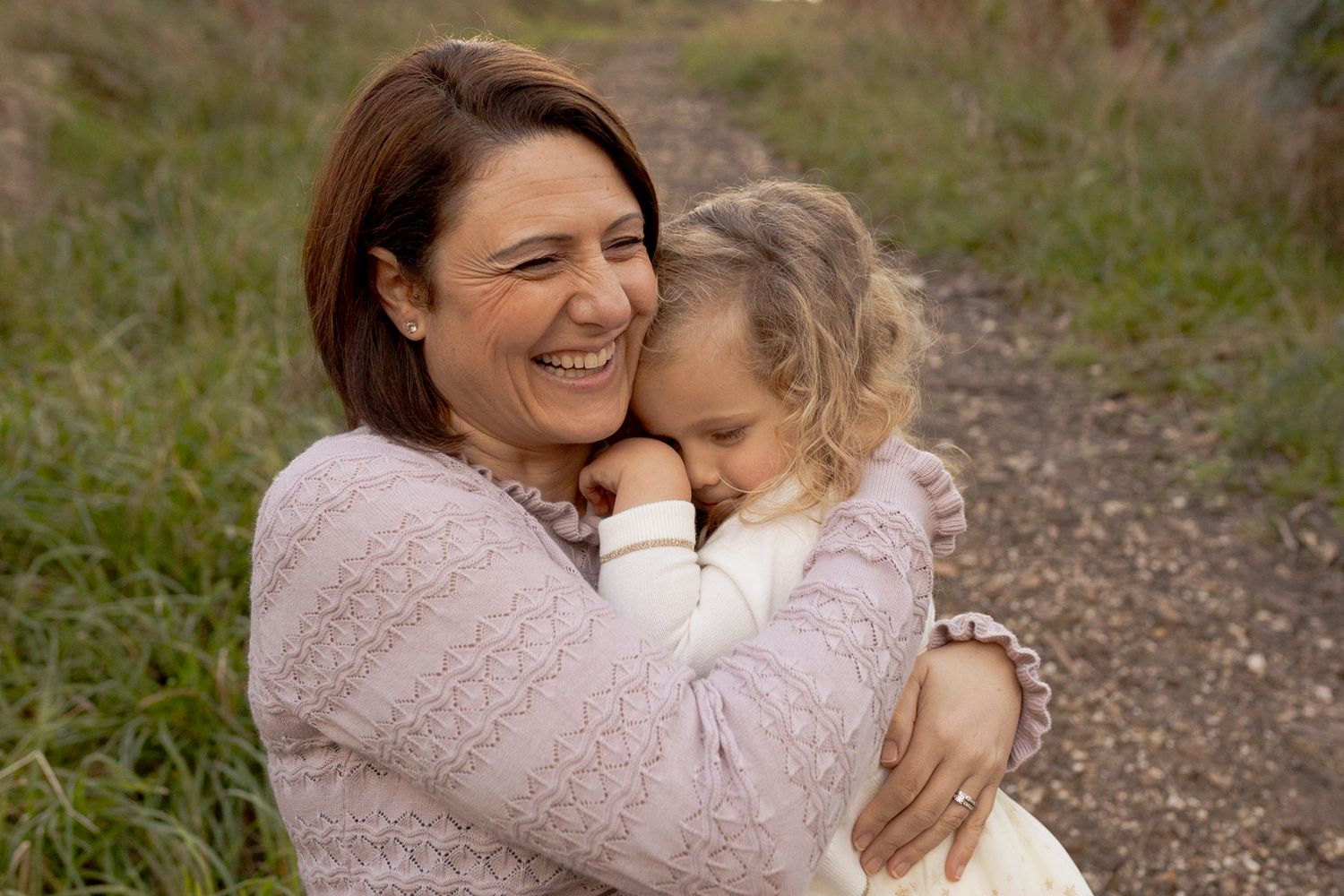 Mother and daughter hugging tightly outdoor family session, Macedon Ranges Melb Vic