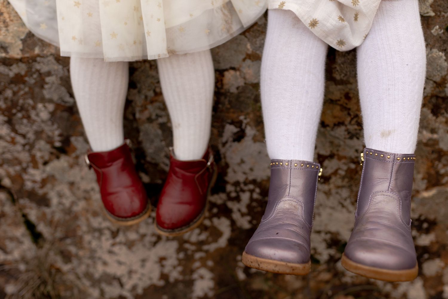 Little girls swinging their feet winter boots Family lifestyle outdoor session Macedon Ranges, Melbourne Victoria