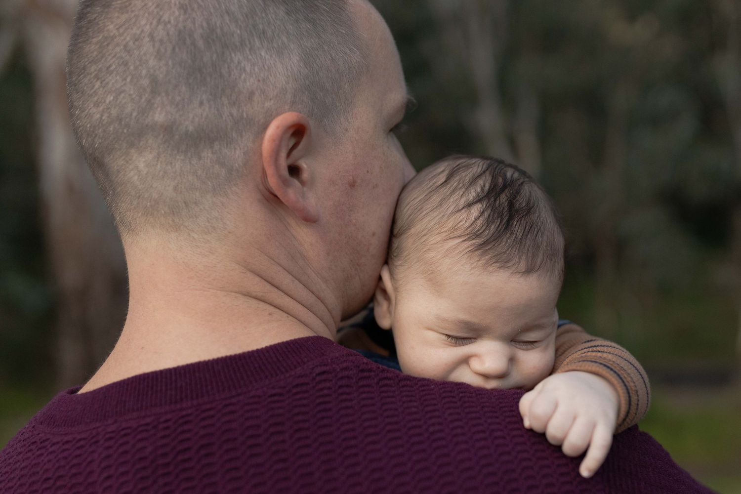 Newborn baby boy sleeping on his dad's should, tiny little hand leaning over, Newborn family shoot Sunshine North Melbourne, Victoria