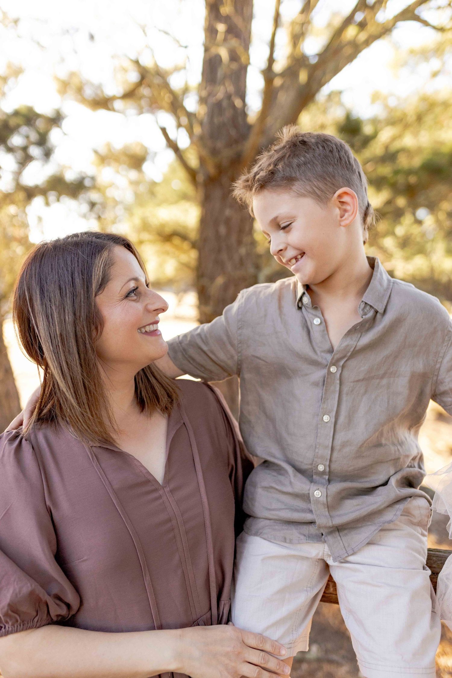Mother and son looking at each other and smiling Outdoor at home family session Gisborne Melb Vic