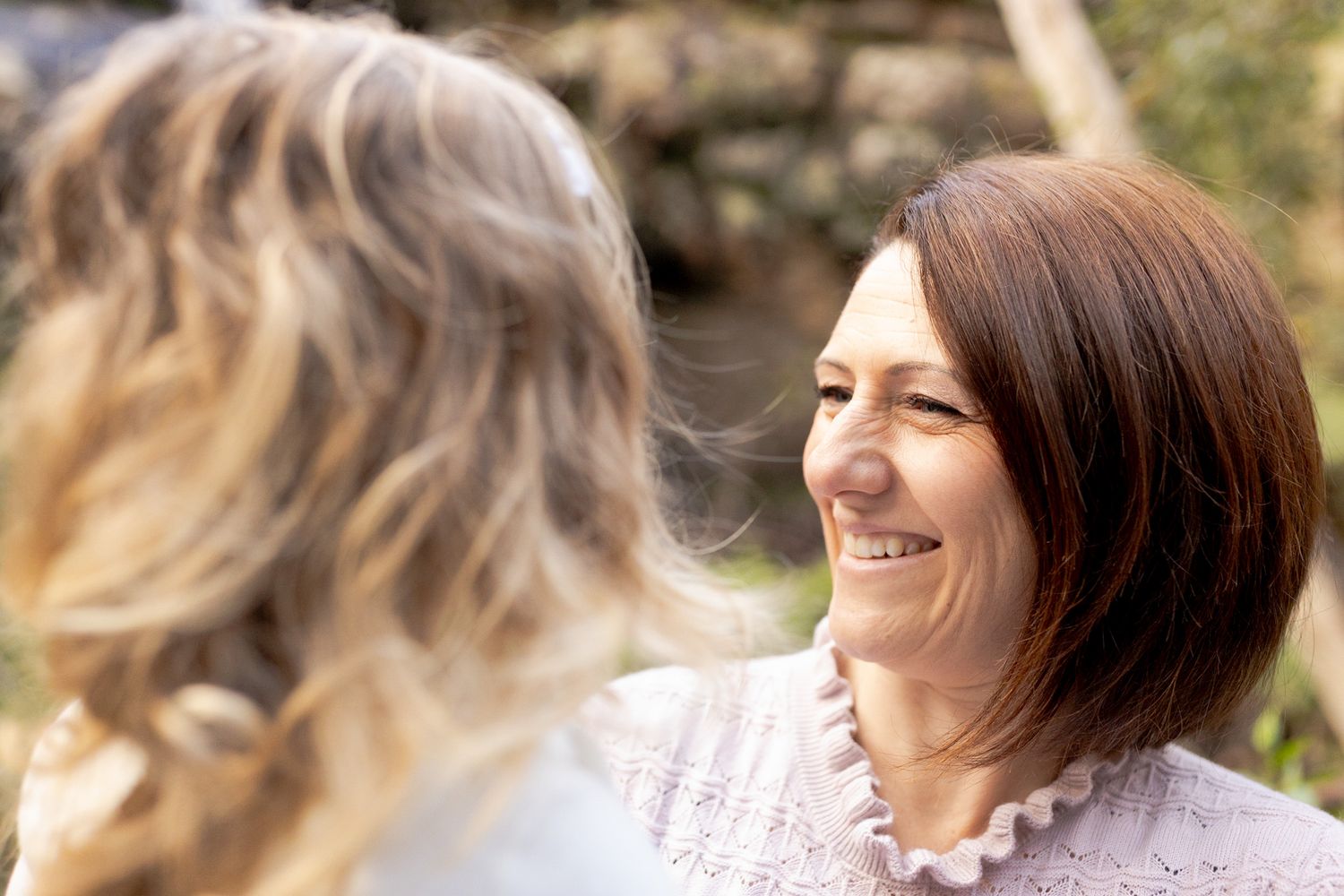 Mum smiling at her daughter in her arms outdoor family session Macedon Ranges Melb Vic