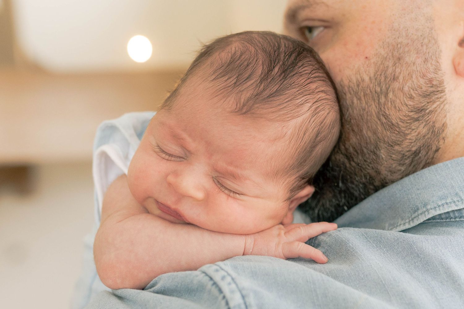 newborn baby boy resting on his dad's shoulder newborn photoshoot Melbourne's West newborn Photography