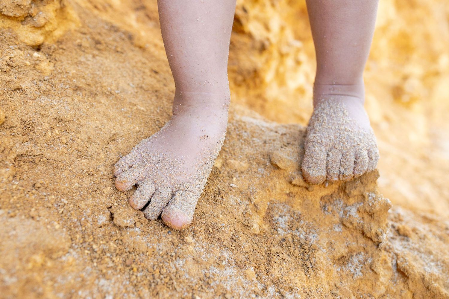 Toddlers little sandy feet at the beach Outdoor family session Torquay