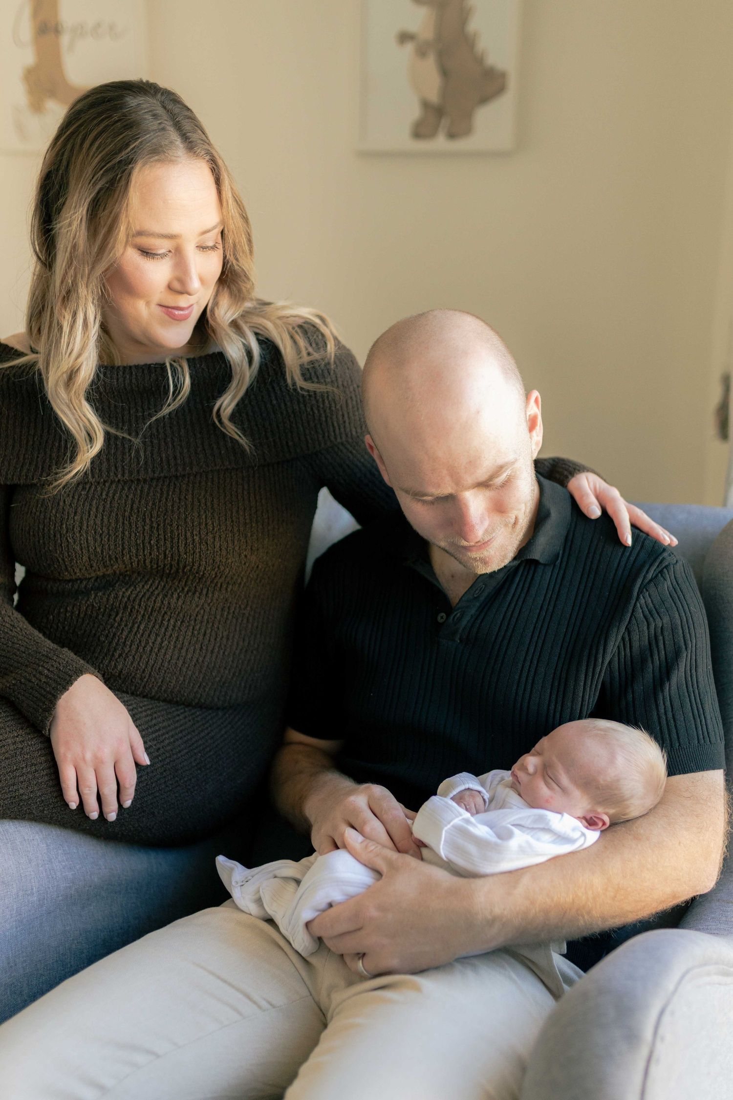 Parents looking down at their newborn