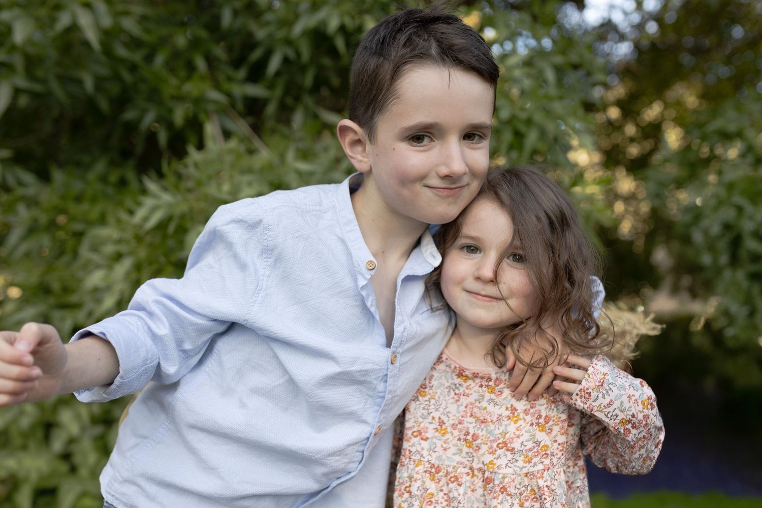 Brother and sister hugging outdoor at home family session. Woodend, Melb Vic