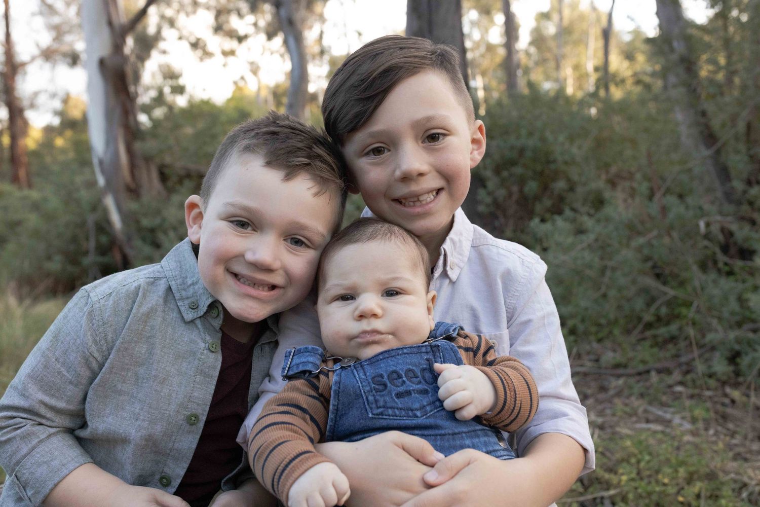 My three sons hugging and smiling in the bush outdoor family session. Sunshine North Melb Vic