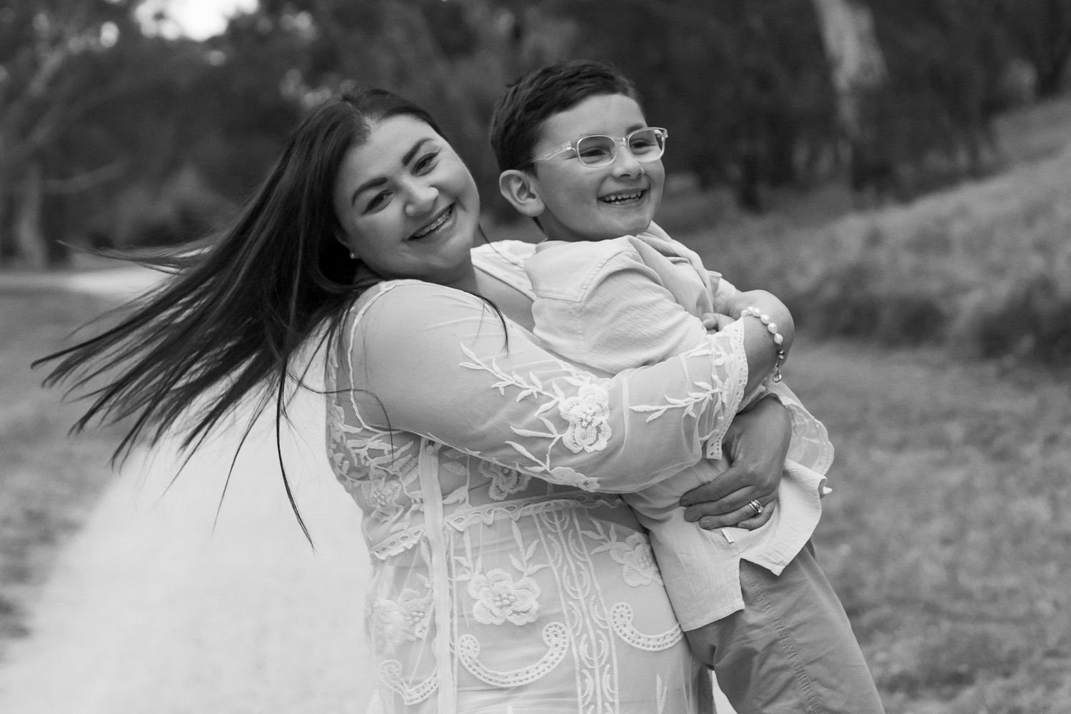 Mum spinning around holding her son black and white family outdoor photography Avondale Heights Melbourne's West Family photographer