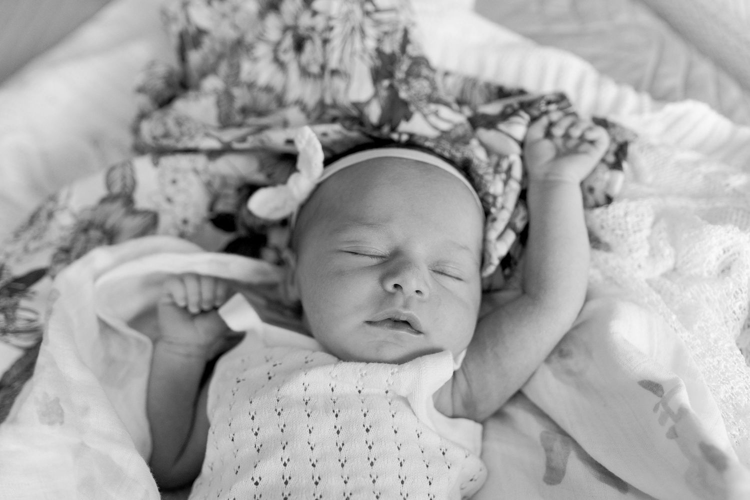 Newborn baby girl stretched out on the bed big bow. Little sister, family of four at home newborn session Caroline Springs, Melb, Vic