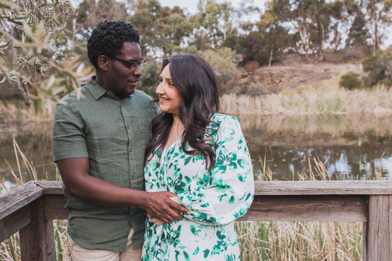 Couple smiling at family outdoor family session with lake in the background, Newport Lakes, Melb, Vic