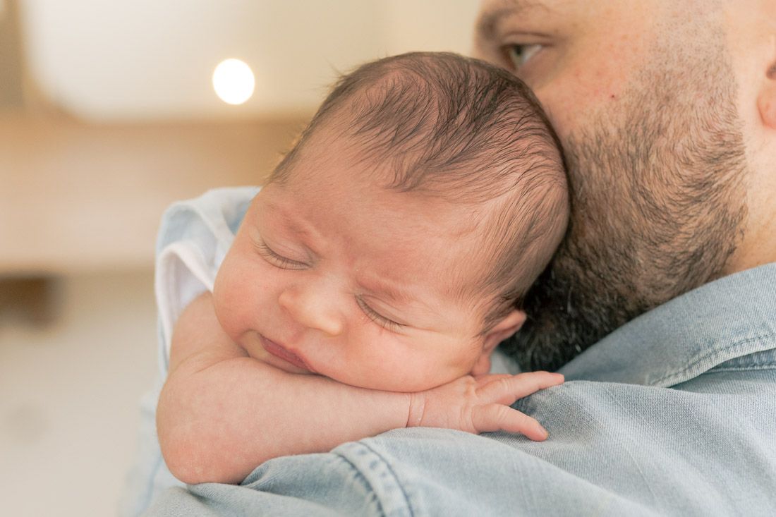 newborn baby boy resting on his dad's shoulder newborn photoshoot Melbourne's West newborn Photography
