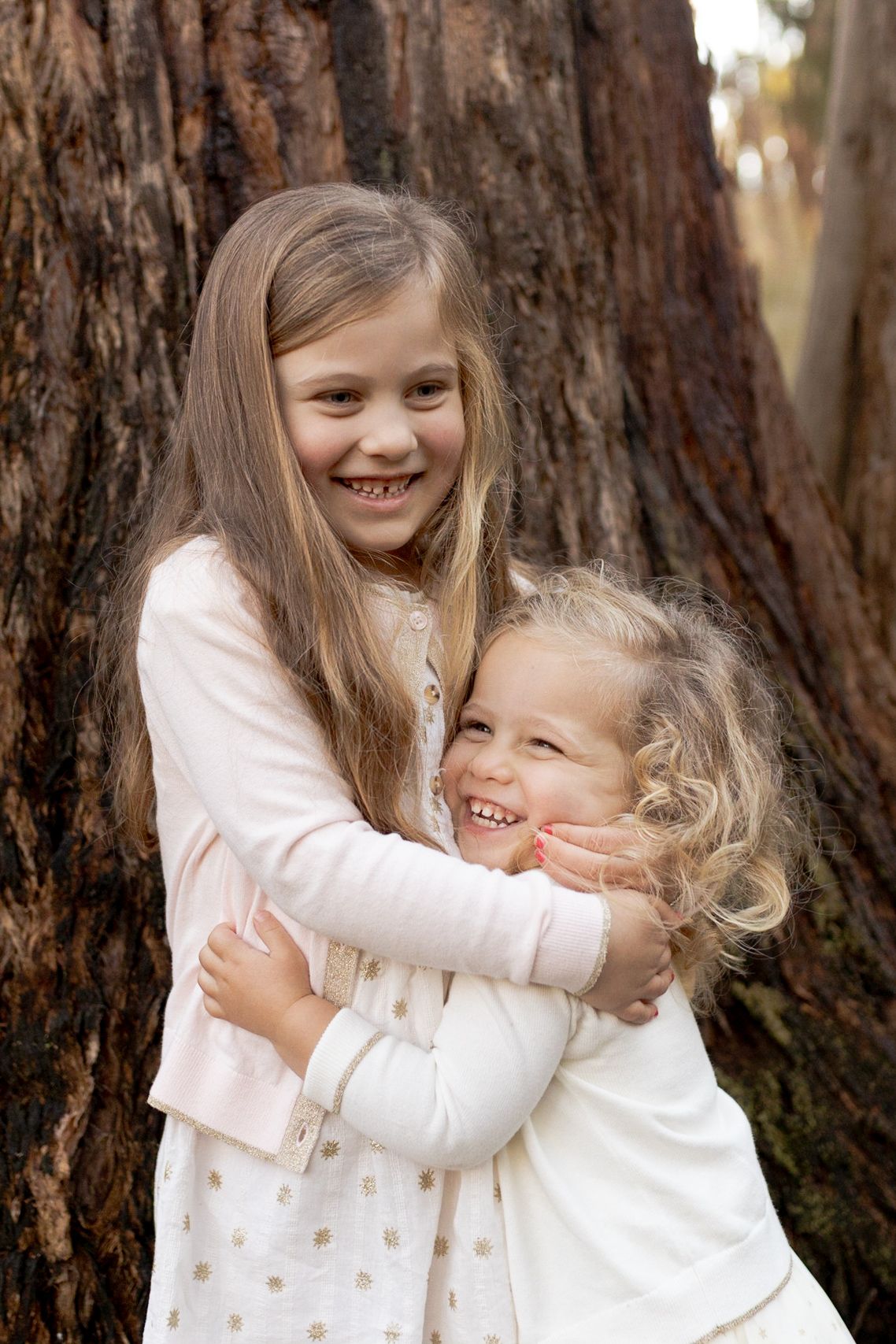 Sisters hugging and laughing Outdoor family session Macedon Ranges Melb Vic