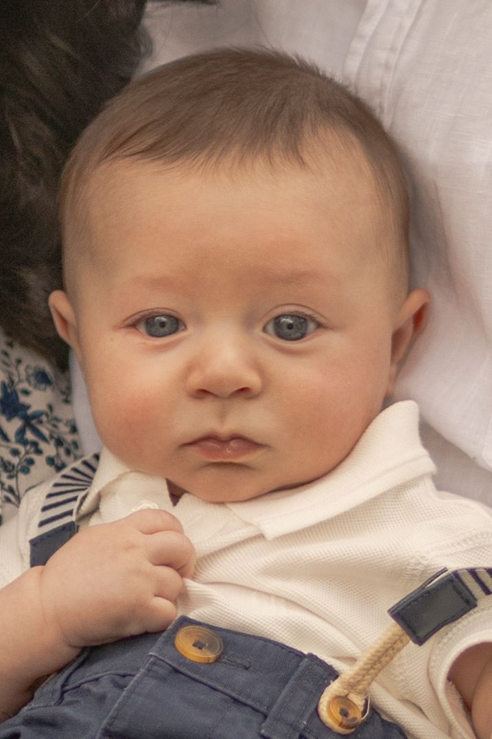 Close up of newborn baby boy looking calm and peaceful Outdoor family session Sunshine North Melb Vic