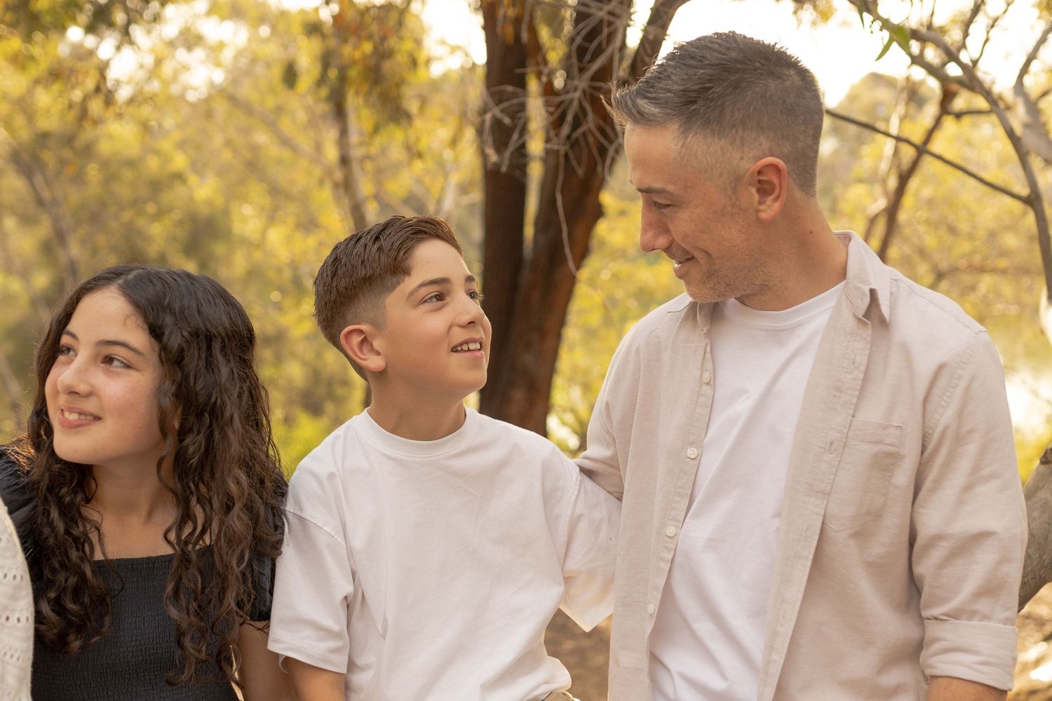Father and son looking at each other warm sunlight smiling  outdoor family session Newport Lakes, Melb, Vic