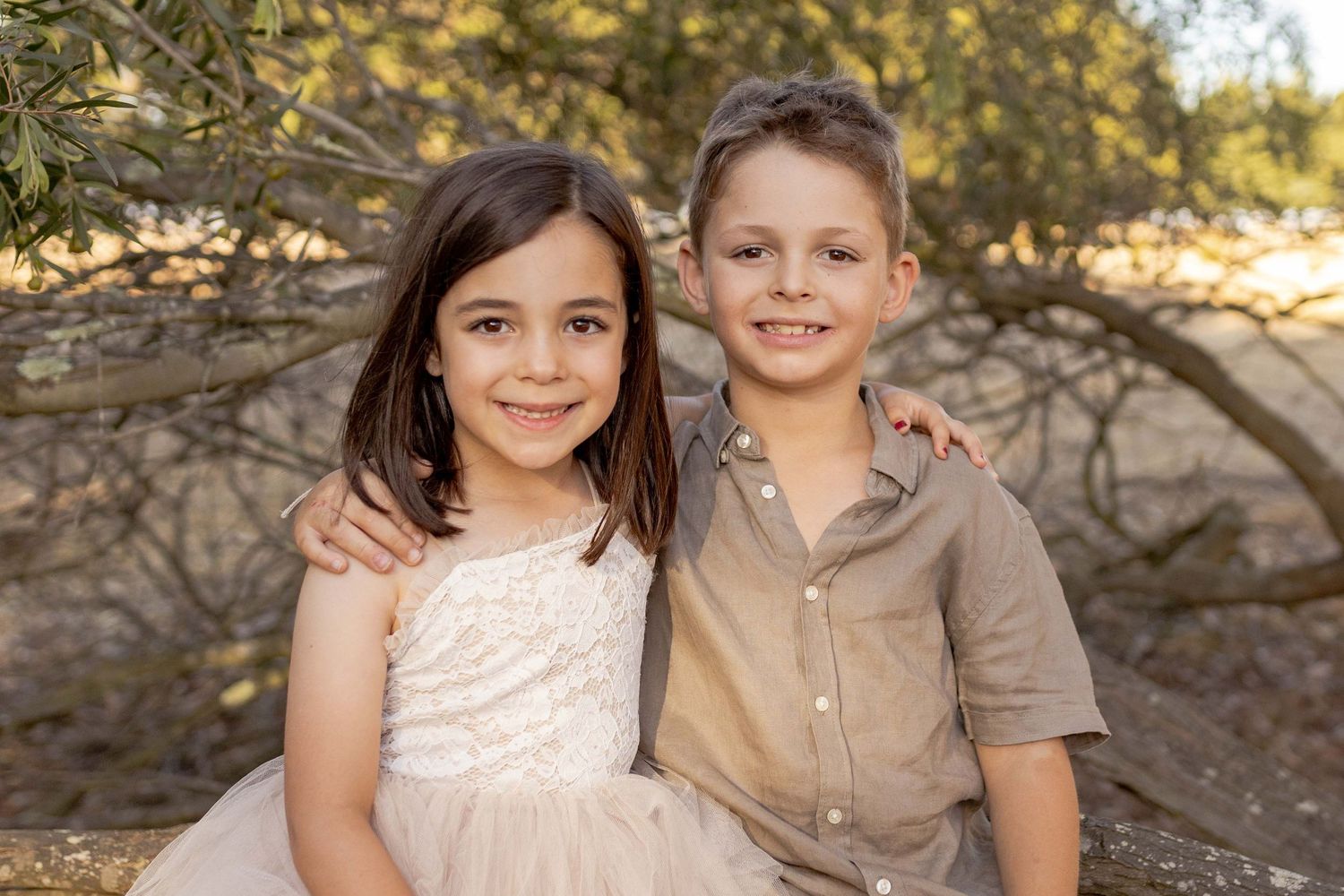Siblings hugging and smiling Outdoor at home family session Gisborne Melb Vic