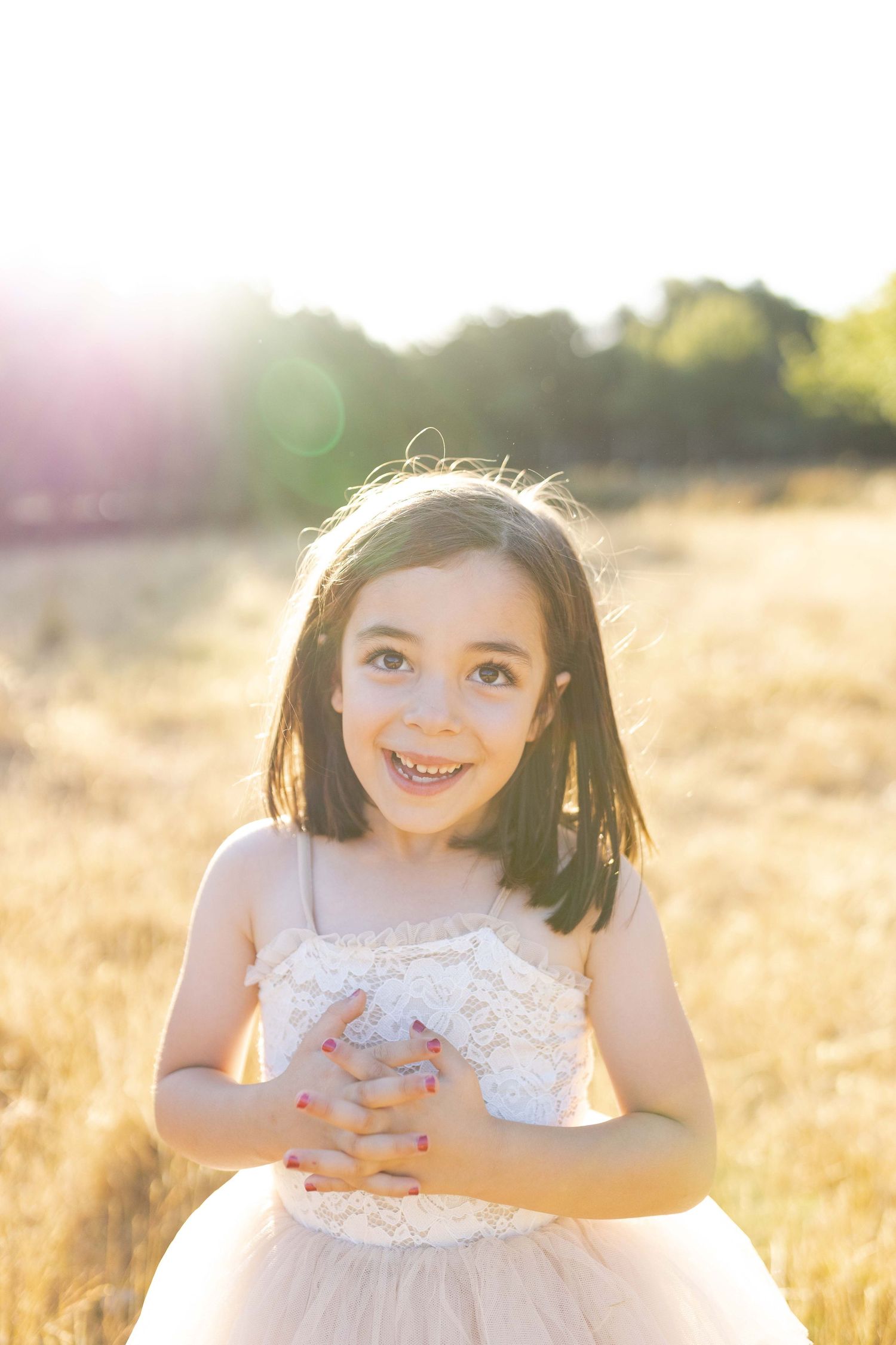 Little girl smiling Outdoor at home family session Gisborne Melb Vic