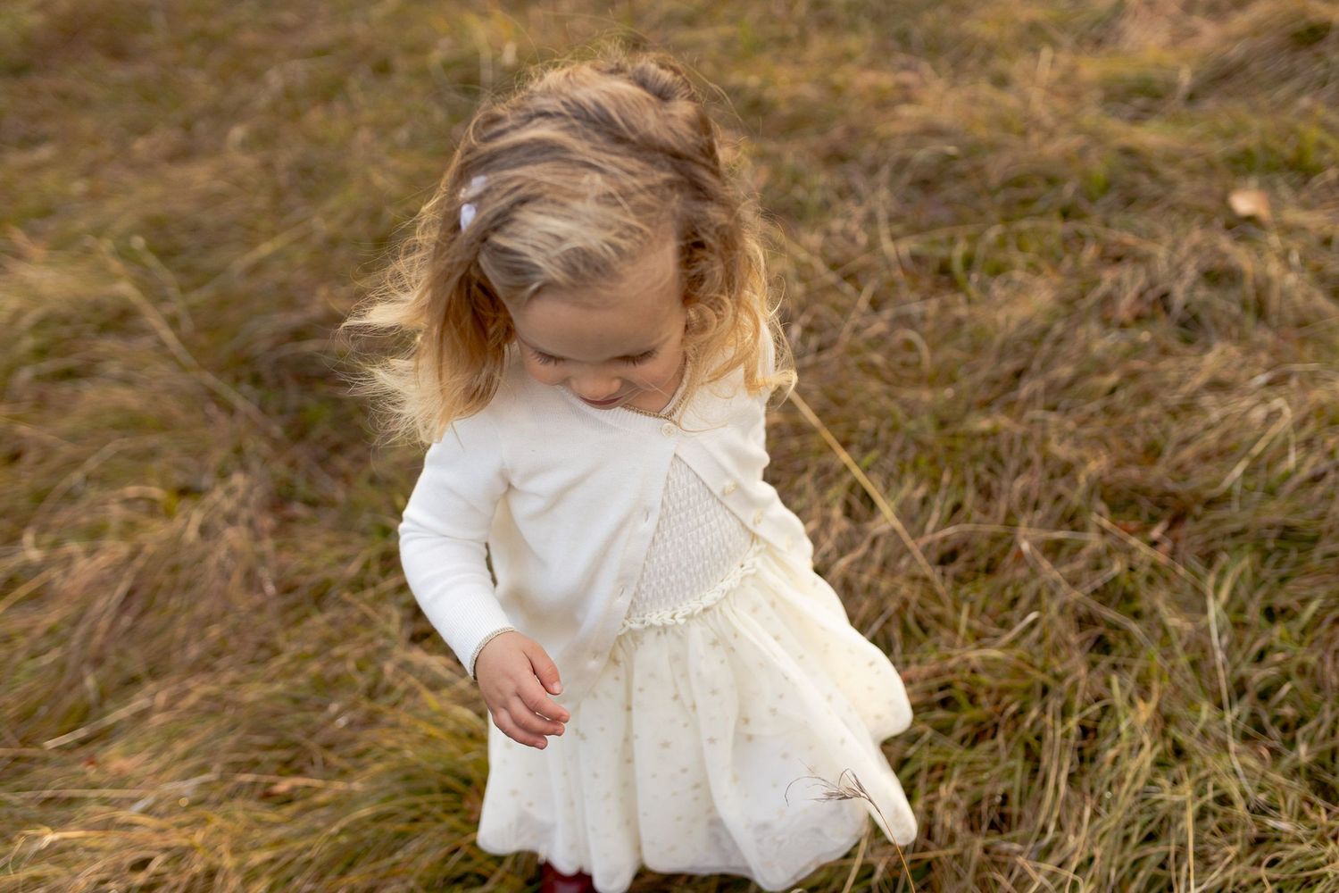 Little girl twirling in a field big smile Outdoor family session Macedon Ranges Melb Vic