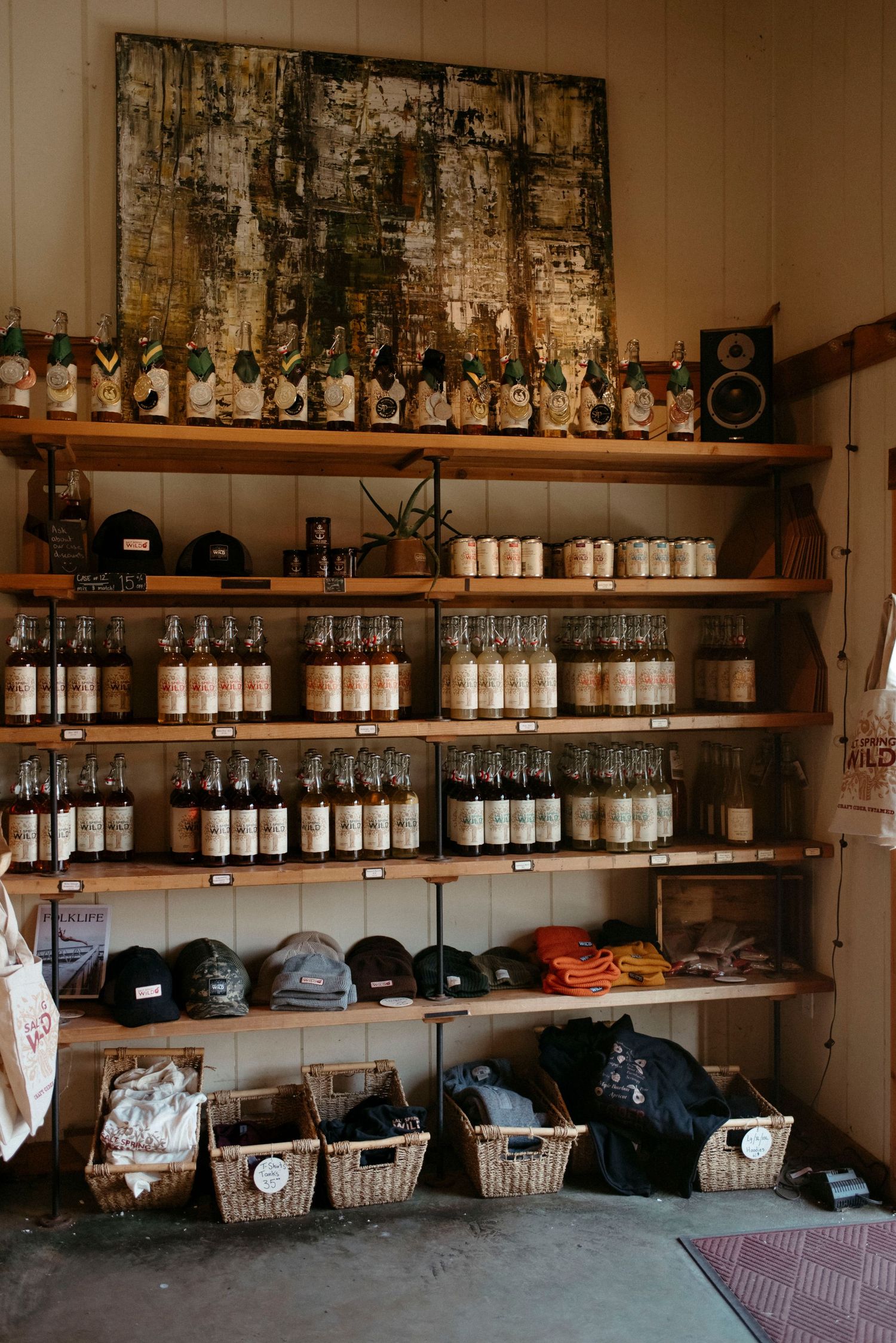 salt spring wild cider wall of ciders and merch