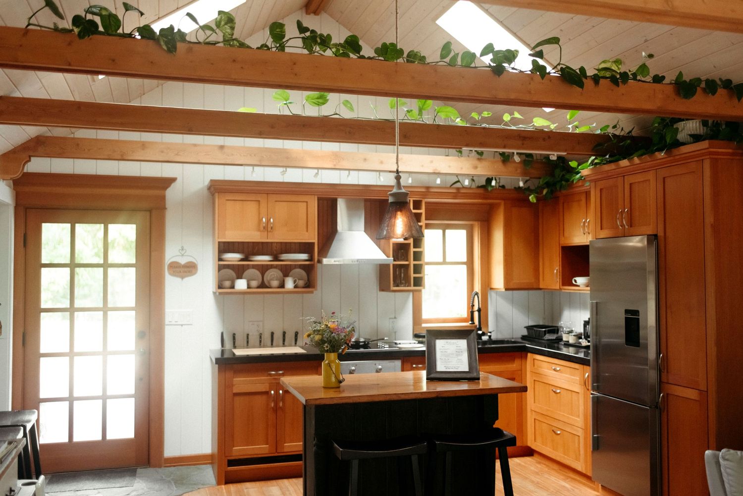 warm wood, farm style kitchen inside the wild plum cottage on salt spring island