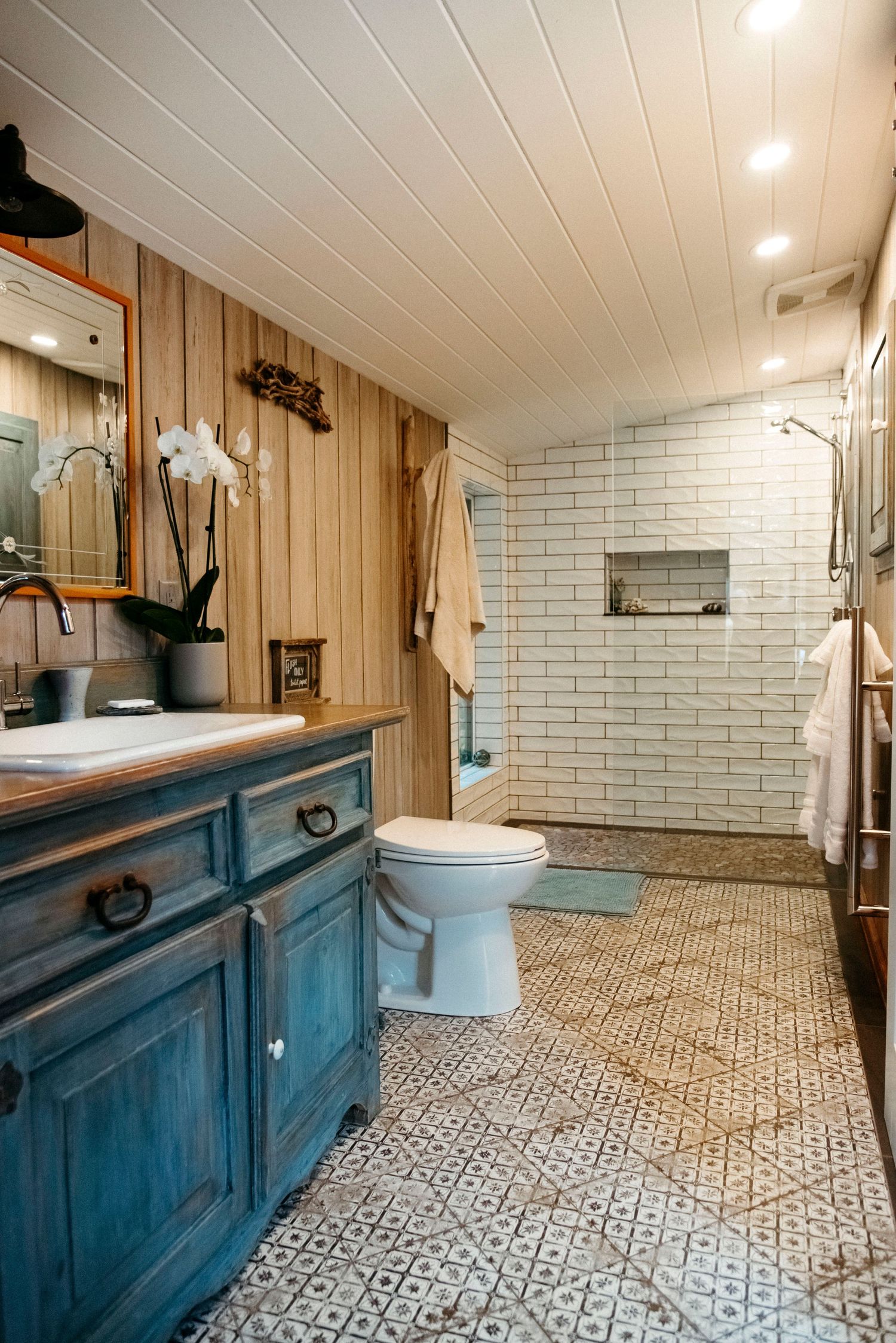 wild plum cottage farm style renovated bathroom with heated floors and glass shower