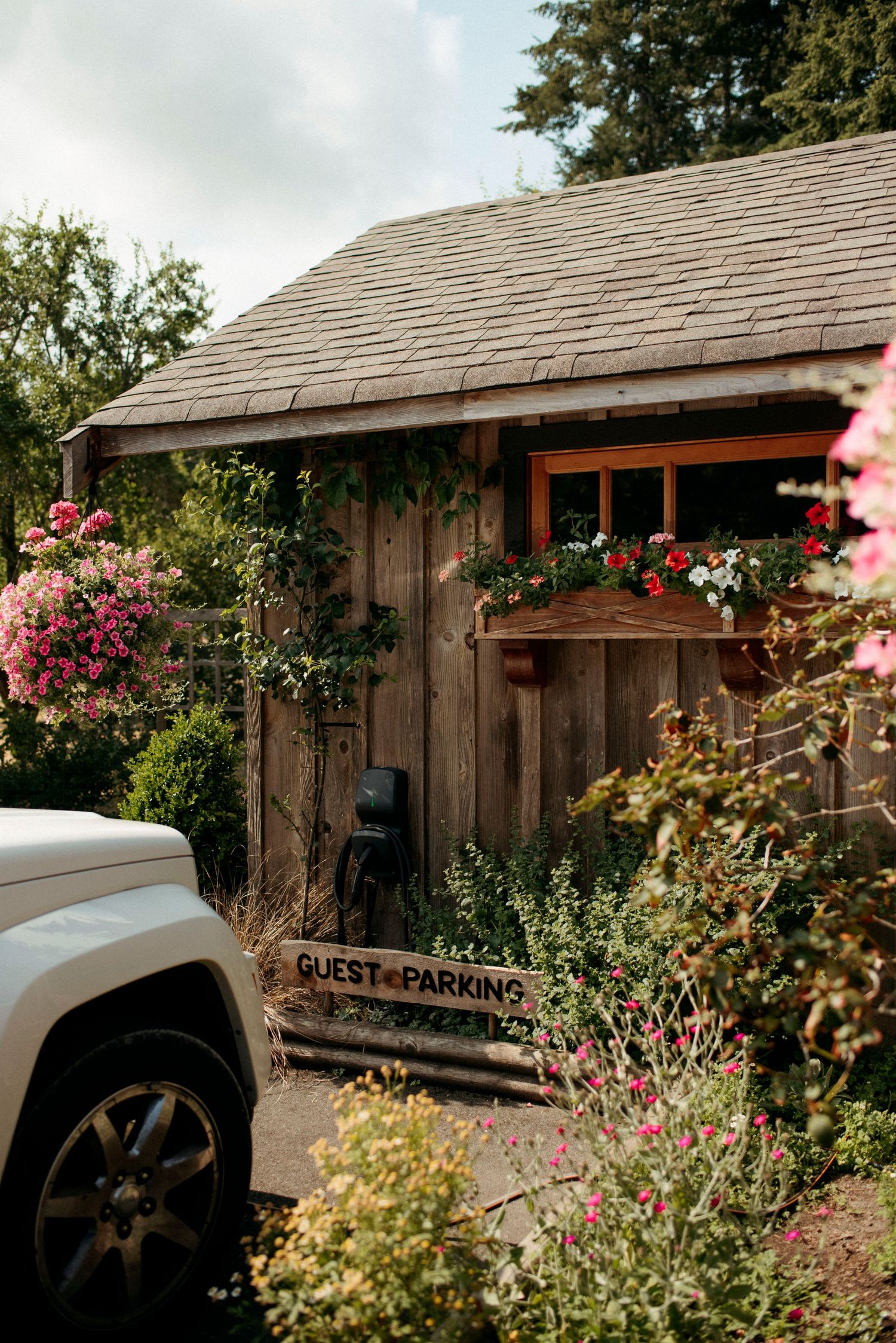 guest parking spot with EV charger at wild pkum cottage