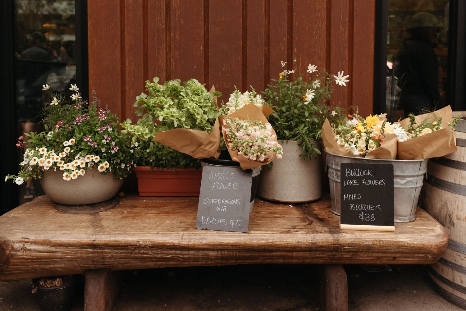 floral stand outside of woodshed on salt spring island