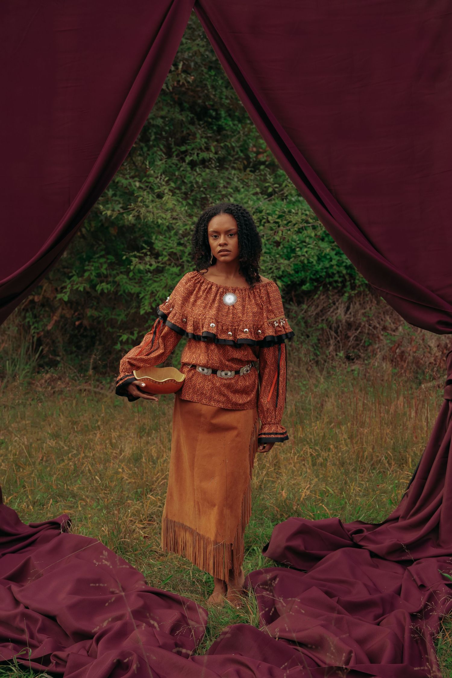 Afro-Indigenous woman photographed in traditional Native American clothing