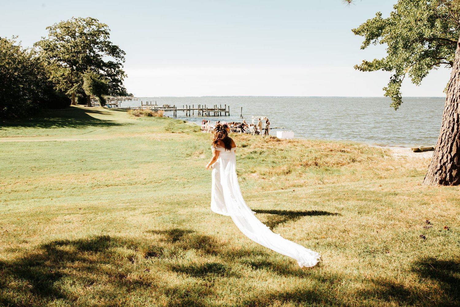 Bride walking down aisle of oceanside micro-wedding in Virginia