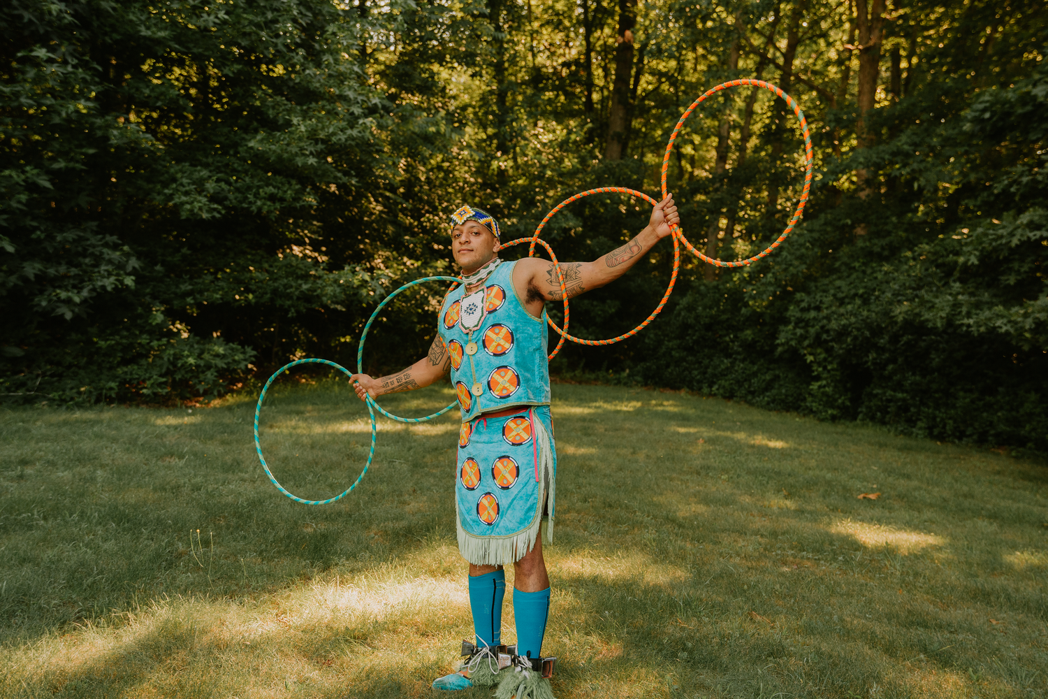 Native American hoop dancer in colorful Indigenous regalia - photojournalism