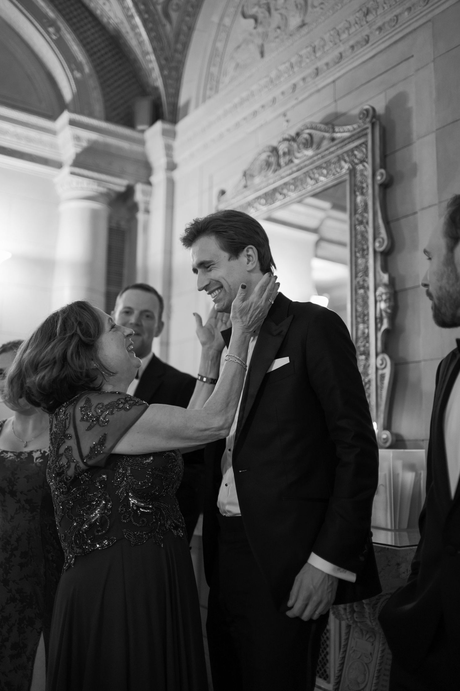 A series of black and white photographs showing couples dancing and socializing at an elegant formal event.