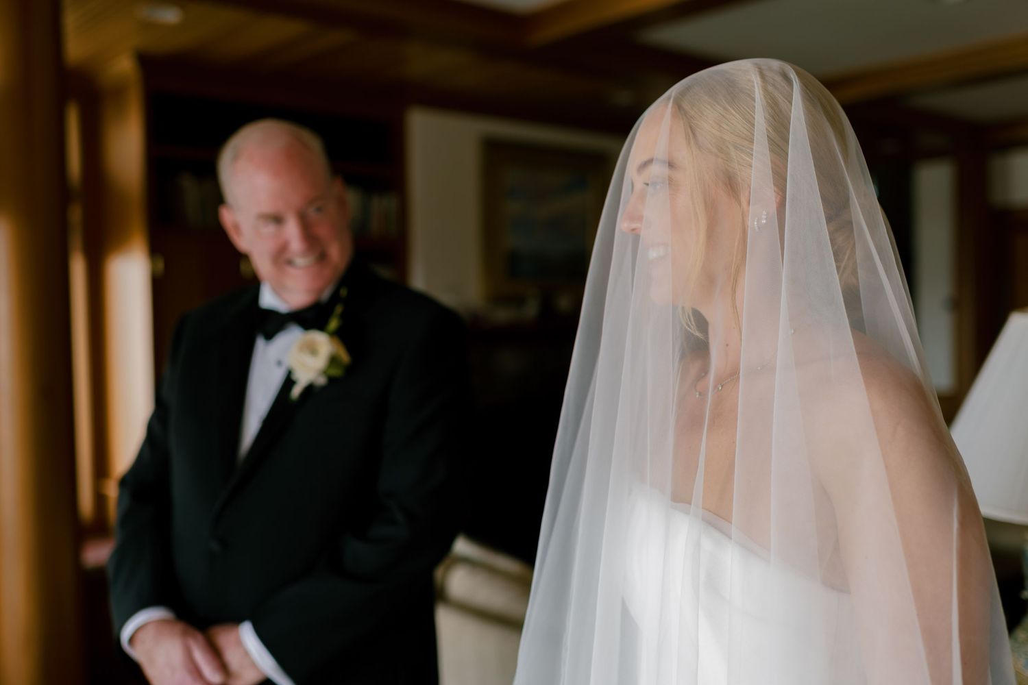 An emotional moment captured between two people during a wedding ceremony indoors.