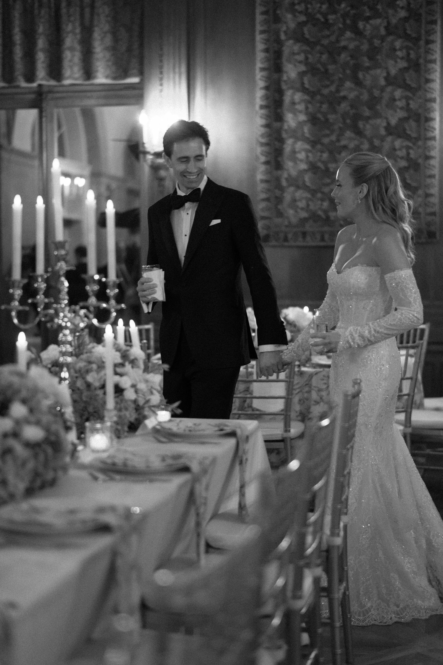 Elegant black and white wedding reception photos showing couple at candlelit tables with formal decor.