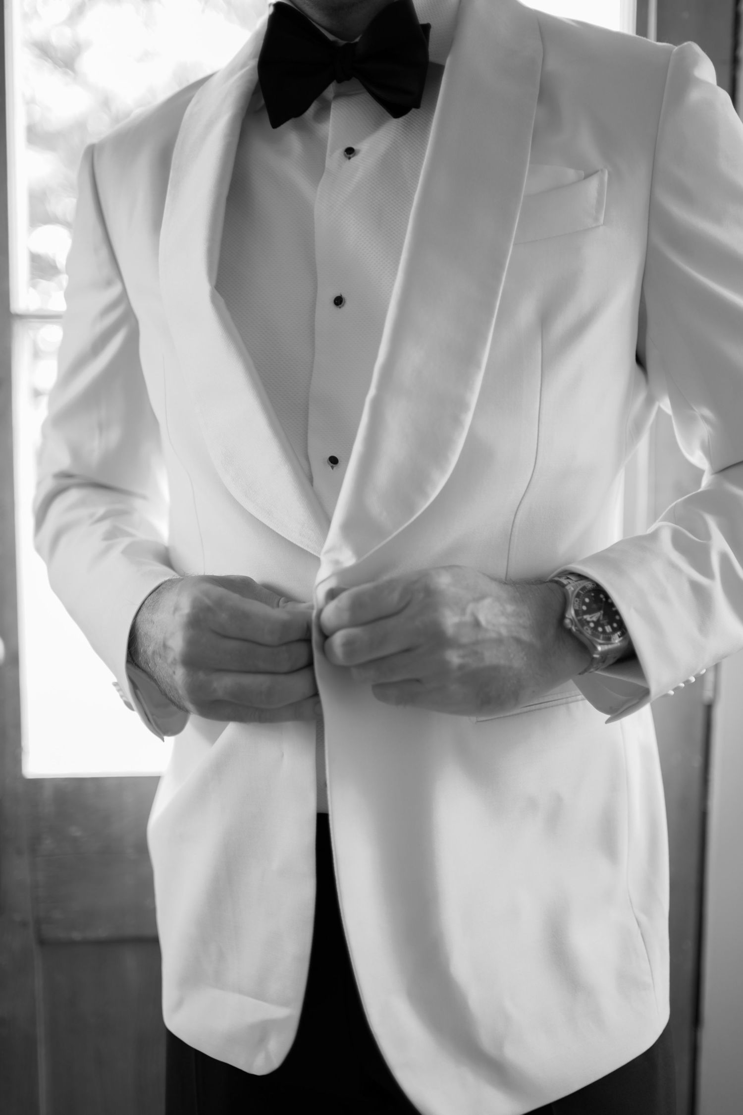 Close-up details of white tuxedo jackets showing elegant lapels and bow ties in a formal wedding attire collage.