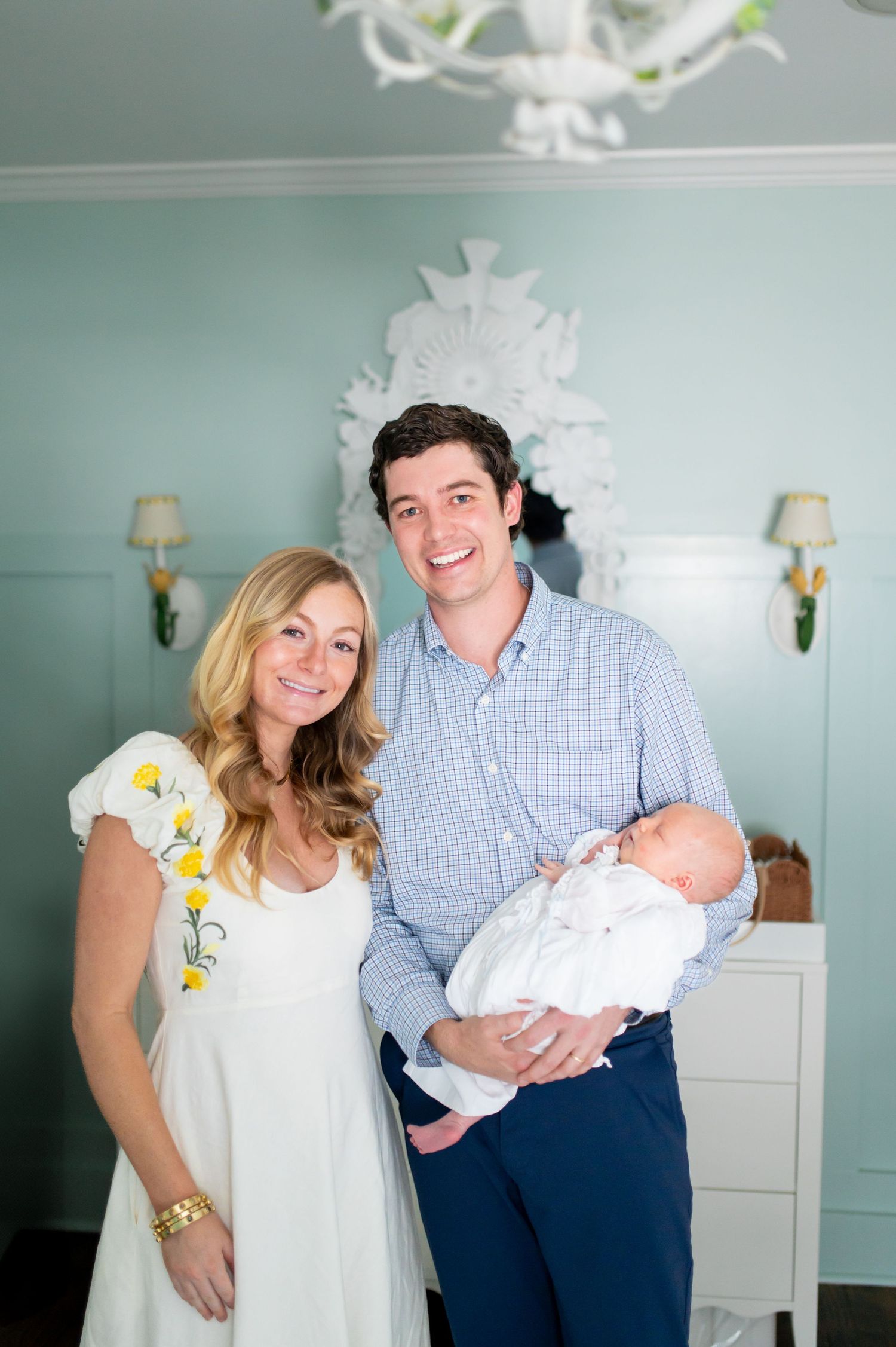 Lifestyle photos in a mint green nursery with white decorative snowflakes and furniture.