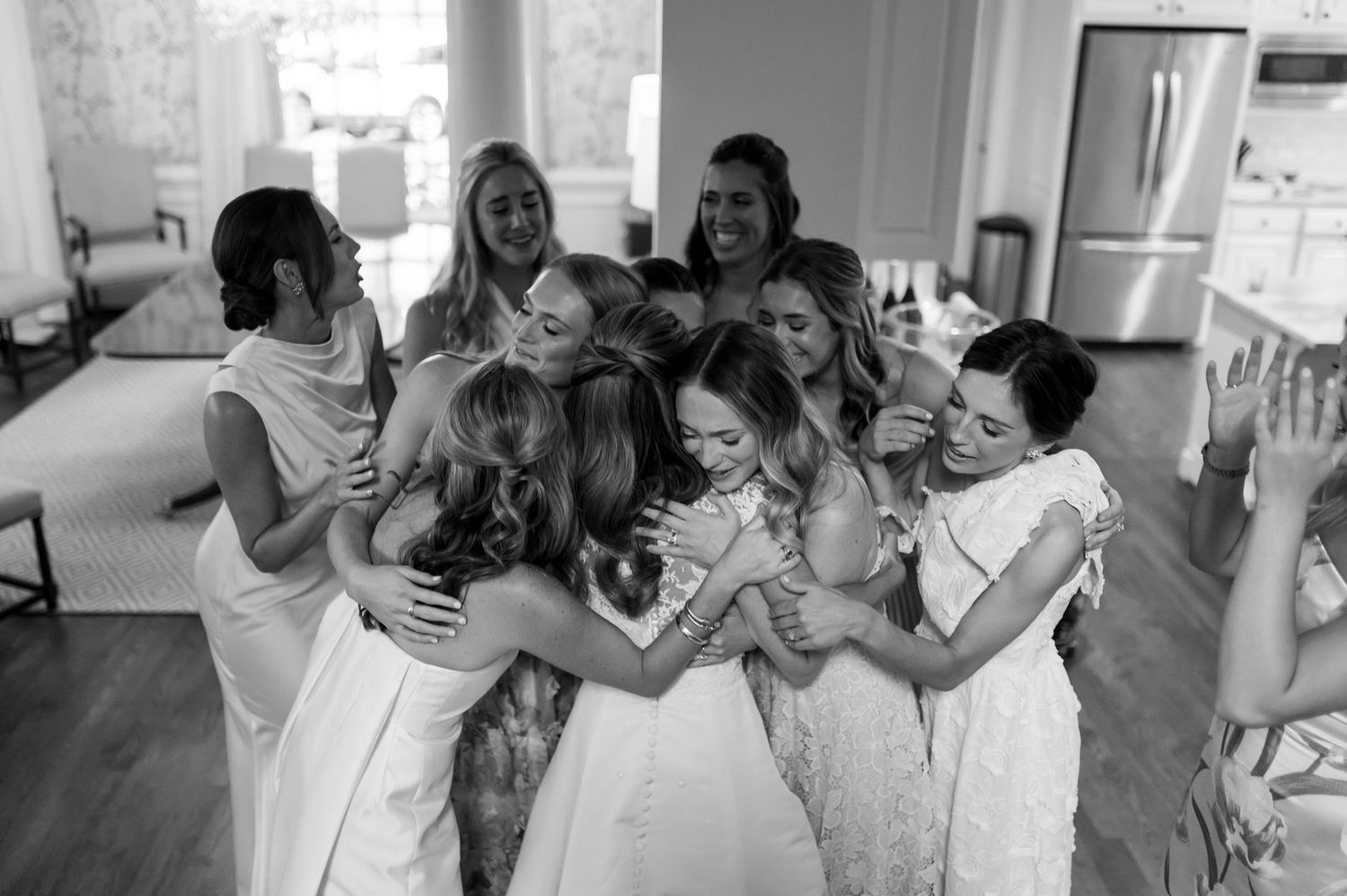 Candid celebration moments captured in black and white at wedding reception.