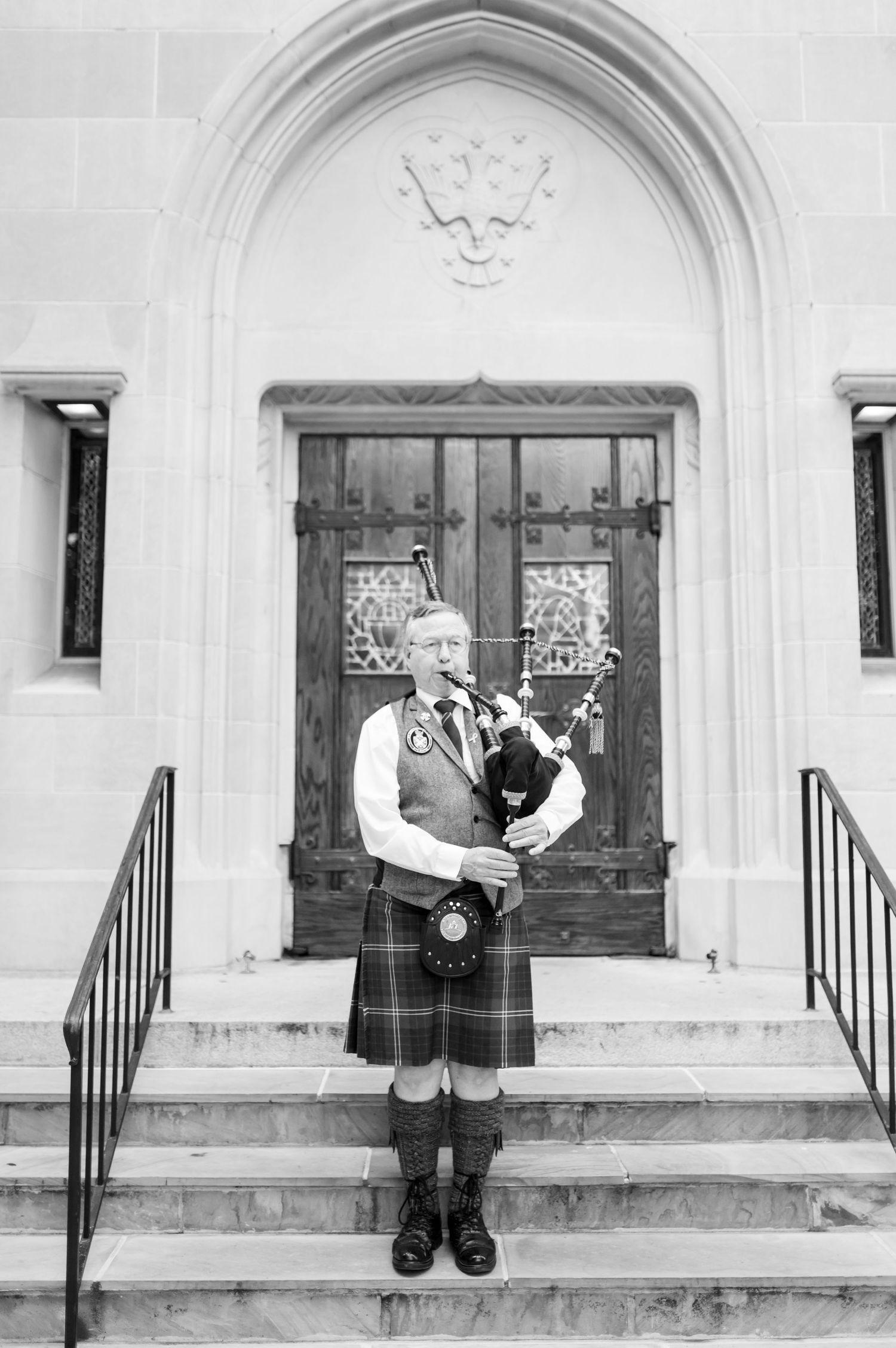 Series of romantic black and white portraits on church steps with classic architecture.