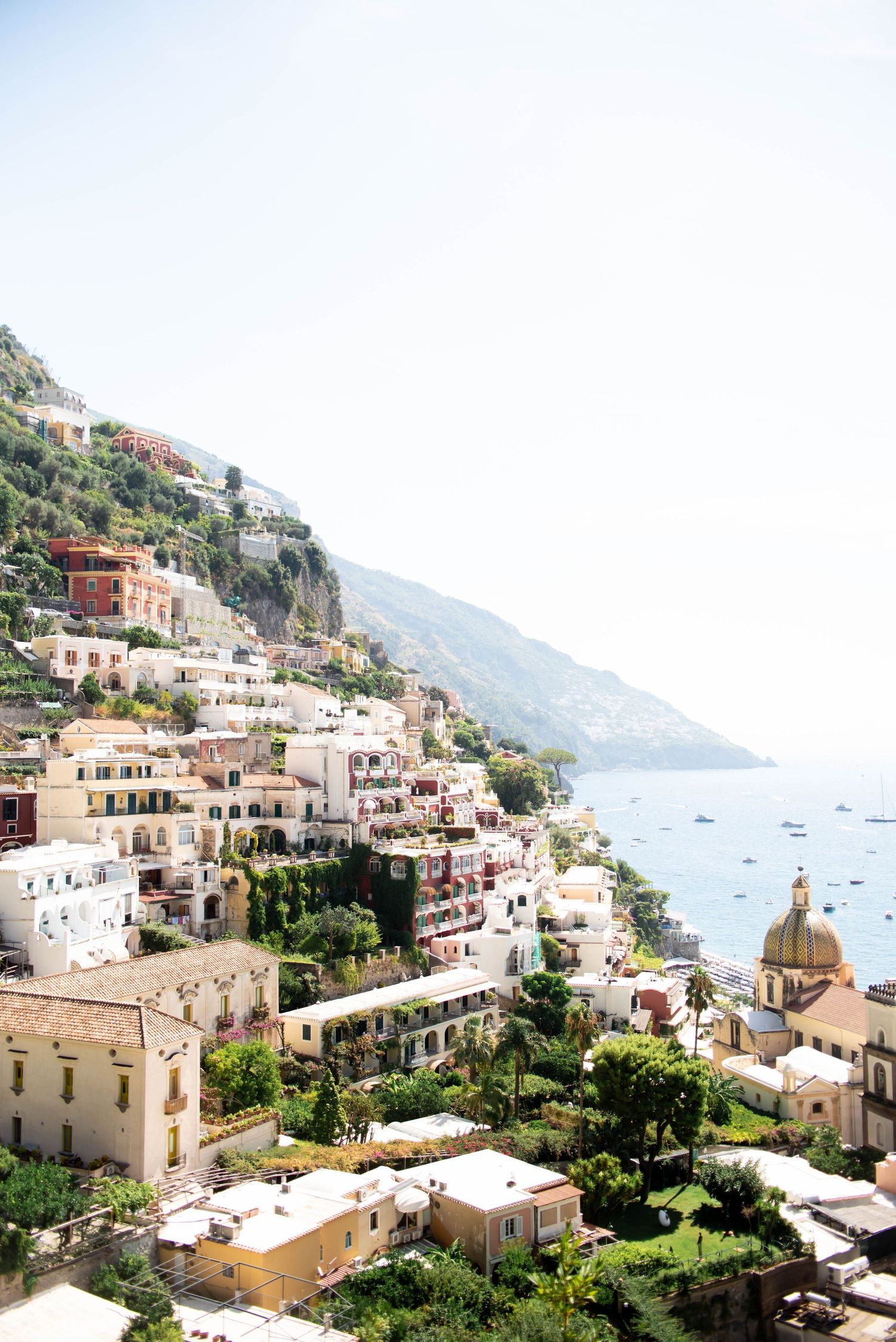 Scenic coastal view of Positano Italy with colorful buildings cascading down hillside.