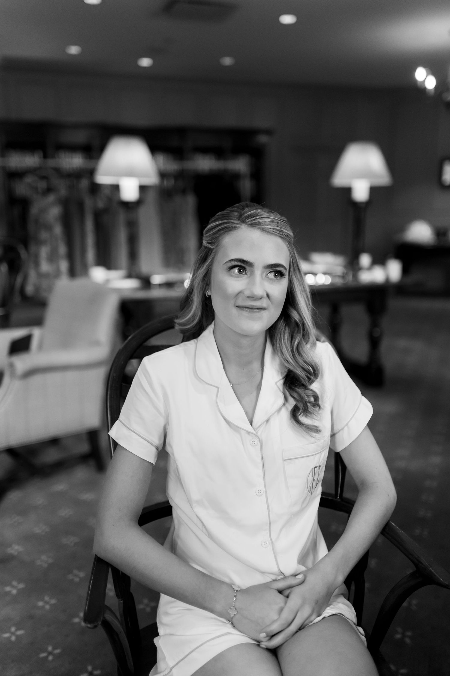 Interior portrait in black and white with soft lighting and modern decor.