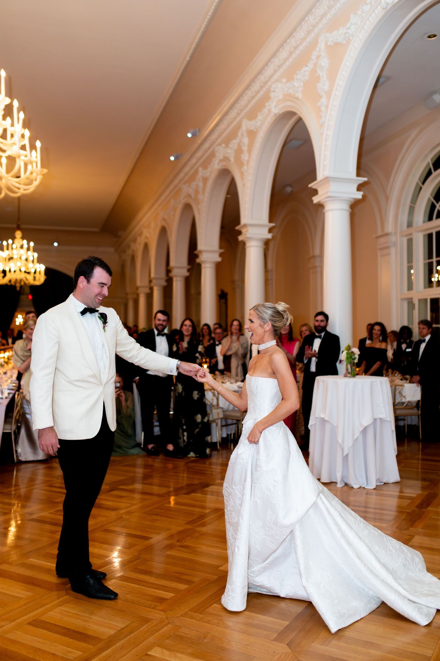 Wedding dance moves captured in a sequence of photos in an elegant ballroom setting.