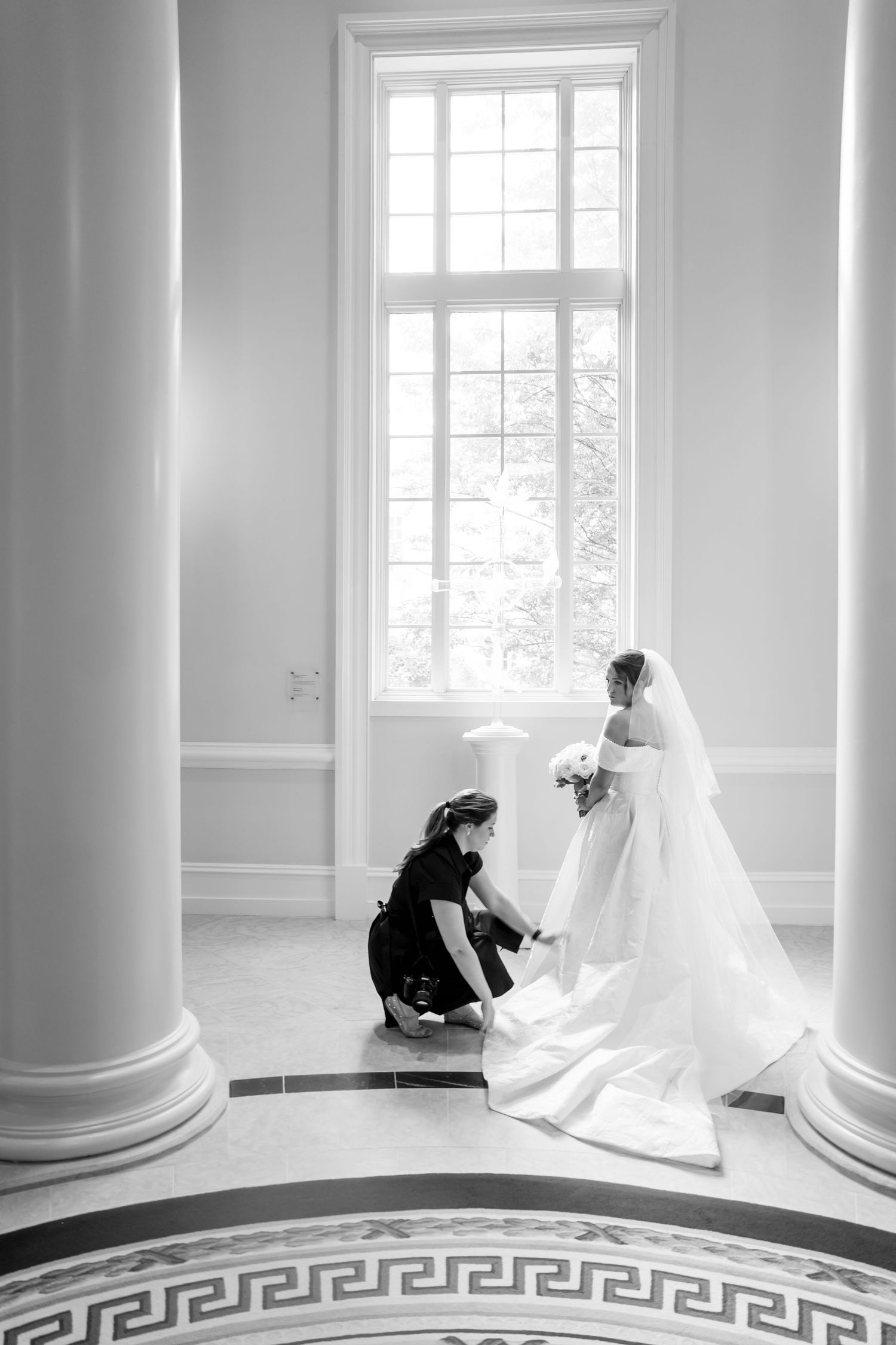 Black and white photos showing wedding dress preparations in elegant room with columns.