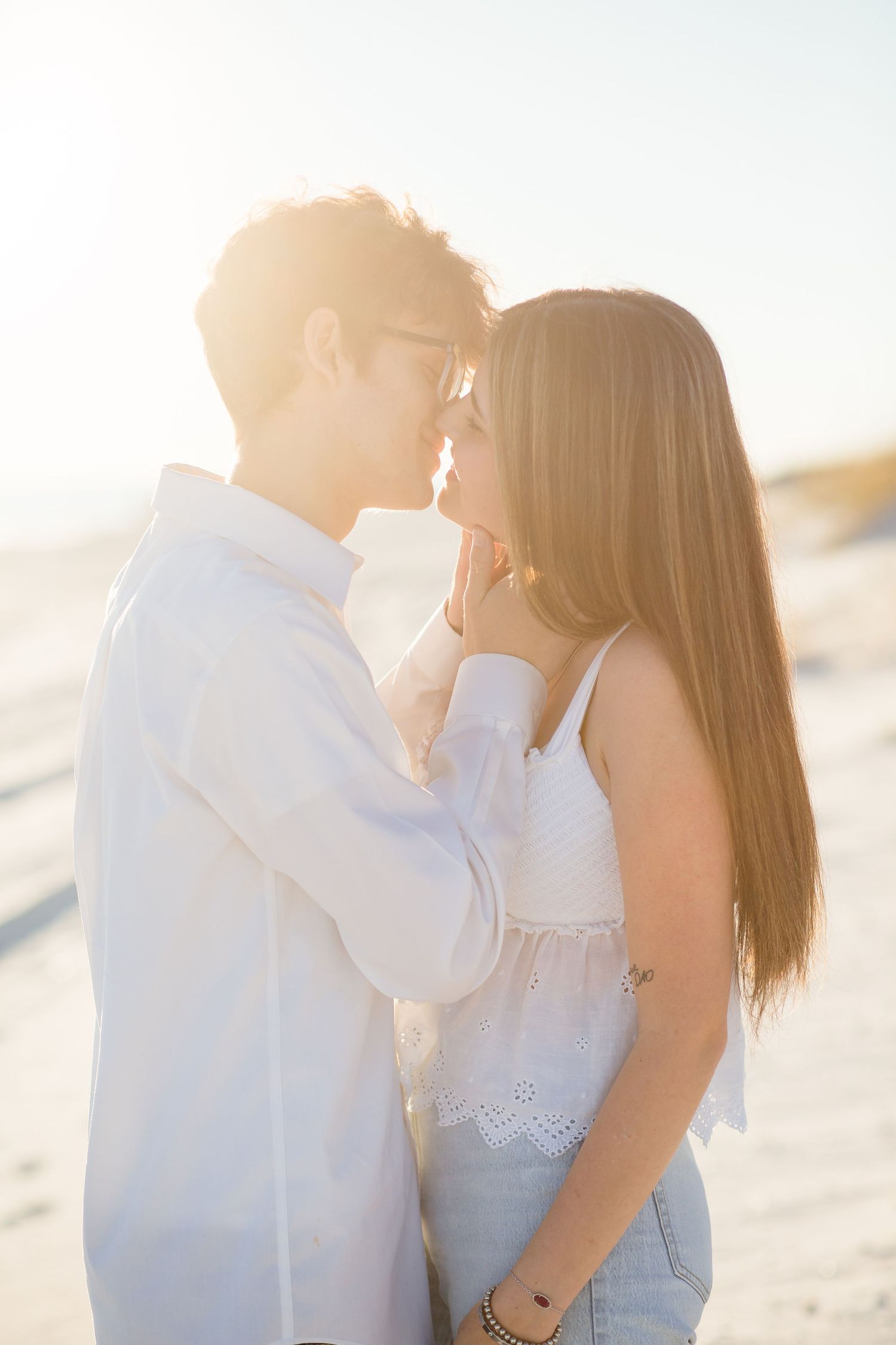 young couple kissing on the beach