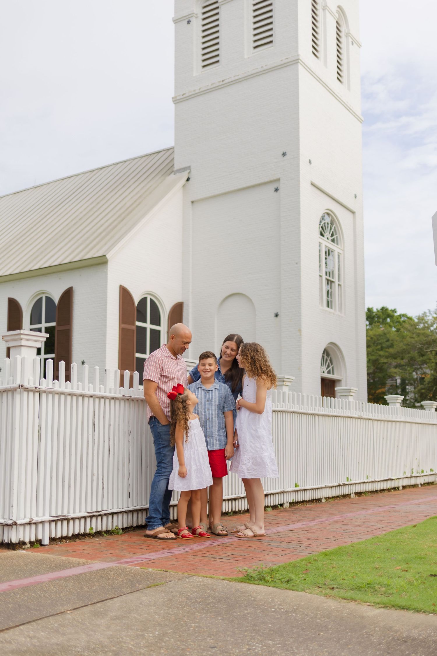 family standing outside church in downtown pensacola